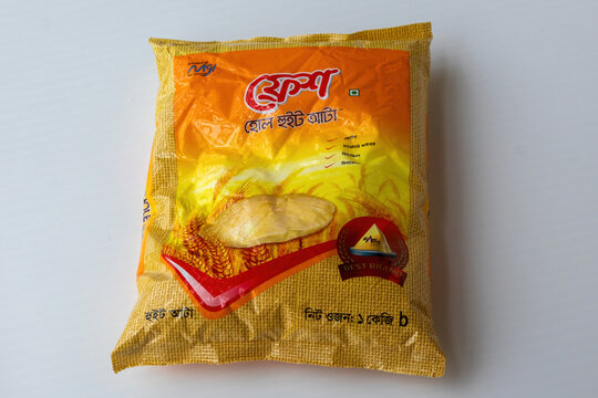 Kishoreganj, Bangladesh - 25 June, 2026 - A studio shot of Fresh Whole Wheat Atta 1 kg retail pack by MGI displayed on white, showing a popular domestic flour brand consumer product item.