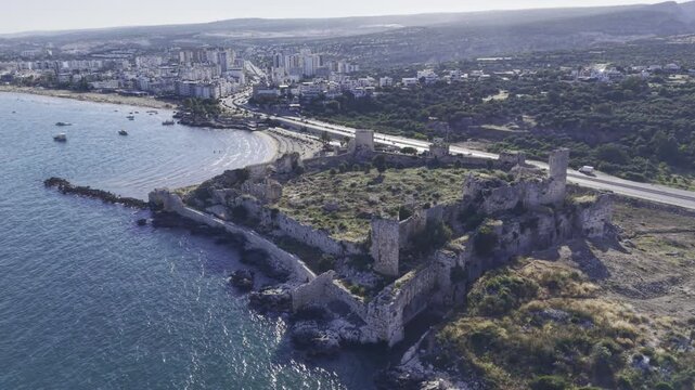 Aerial Drone View of Korykos Castle and Mediterranean Coastline in Mersin, Turkey, Historic Fortress by the Sea at Sunset