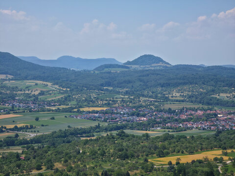 germany, peaceful swabian jura hill landscape overlooking charming small village near dettingen an der erms and kappishaeusern in bright summer