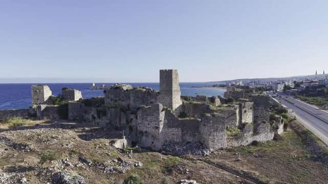 Aerial Drone View of Korykos Castle and Mediterranean Coastline in Mersin, Turkey, Historic Fortress by the Sea at Sunset