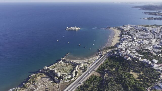 Aerial Drone View of Korykos Castle and Mediterranean Coastline in Mersin, Turkey, Historic Fortress by the Sea at Sunset