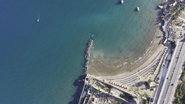 Aerial Drone View of Korykos Castle and Mediterranean Coastline in Mersin, Turkey, Historic Fortress by the Sea at Sunset