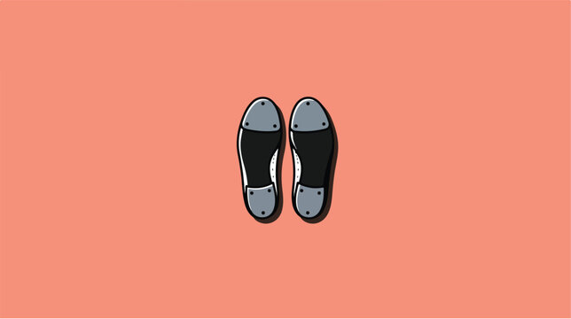A pair of black tap shoes isolated on a solid coral background.