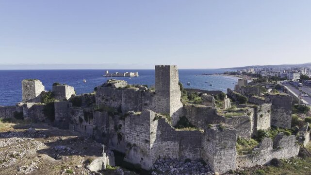 Aerial Drone View of Korykos Castle and Mediterranean Coastline in Mersin, Turkey, Historic Fortress by the Sea at Sunset