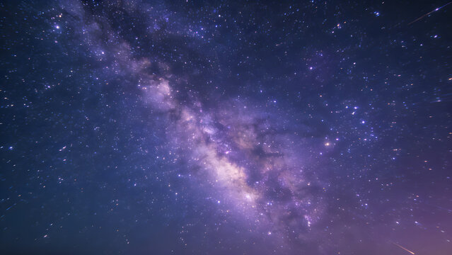 Milky Way galaxy with purple and blue nebulae and star trails on dark background