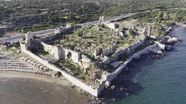 Aerial Drone View of Korykos Castle and Mediterranean Coastline in Mersin, Turkey, Historic Fortress by the Sea at Sunset