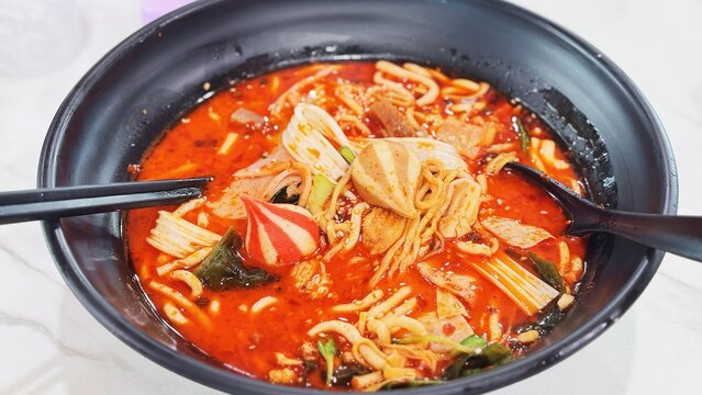 Mala Spicy Red Noodle Soup Black Bowl Top View, Mala Tang self serve , Chinese Hot Pot Food Photography