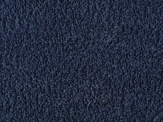 Fototapeta premium Close-up full frame background texture of soft dark navy blue terry cloth cotton towel fabric