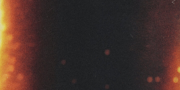 Grainy texture with orange and black tones a distressed photographic effect film grain vintage retro