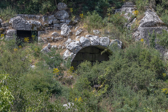 Ruins of the city of Termessos. An ancient city located high in the mountains. The vaults of the buildings in the ancient city are made of huge stone blocks. Stone vaults of ancient buildings.