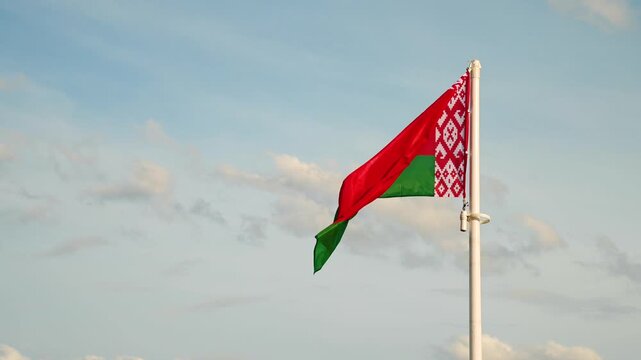 the flag of Belarus flutters in the wind
