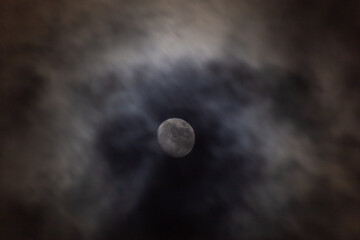 Full moon in the dark night sky with clouds,  © ric