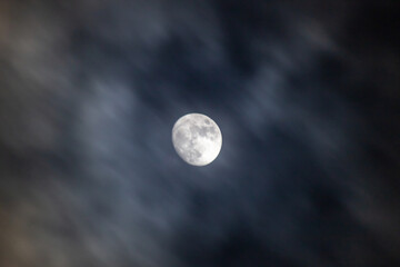 Full moon in the dark night sky with clouds,  © ric