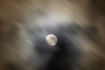 Full moon in the dark night sky with clouds,  © ric