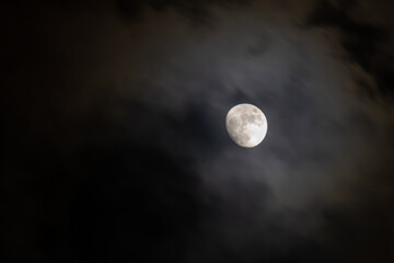 Full moon in the dark night sky with clouds,  © ric