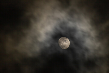 Full moon in the dark night sky with clouds,  © ric