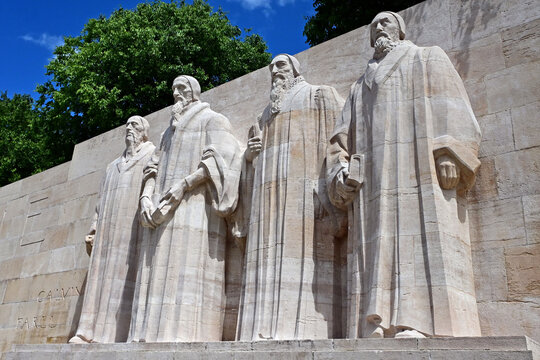 Geneva, Switzerland, Europe - 05.2026 : Prominent reformers statues - Jean Calvin, Guillaume Farel, Th&eacute;odore de Beze and John Knox, reformation wall in Bastions park, Swiss towns coats of arms 