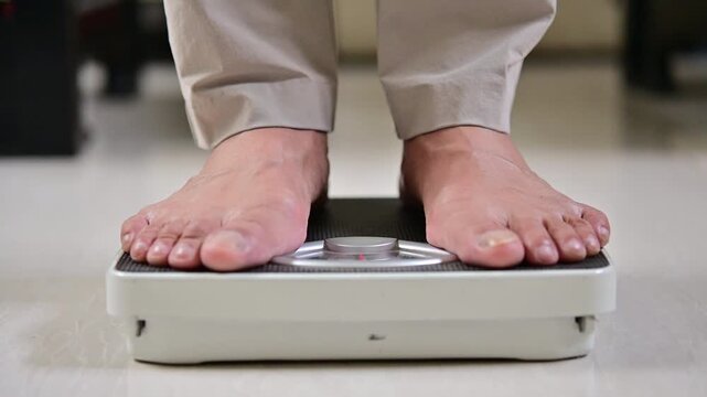 This is a man that doing morning routine weight monitor