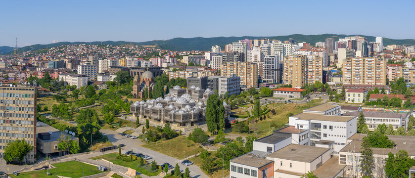 Aerial Panoramic View of Pristina Cityscape with National Library of Kosovo and Christ the Saviour Cathedral