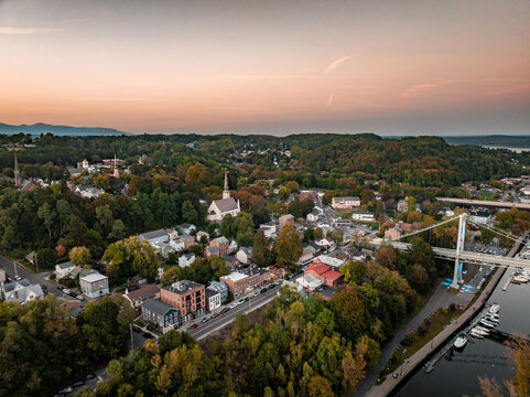 Kingston in Hudson Valley, New York during sunset. Aerial view across bridge over the Hudson River.