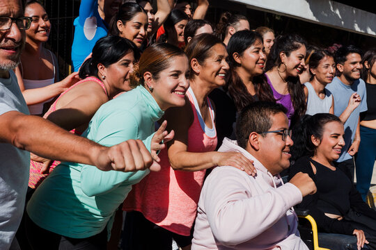 Diverse Group of latin american athletic people and Smiling young Adults in Athletic Wear in Mexico Latin America, hispanic people in wheelchair in social inclusion in sport activity 