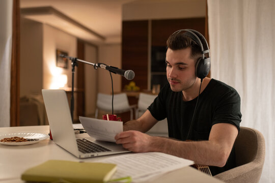 Man writing song in home studio
