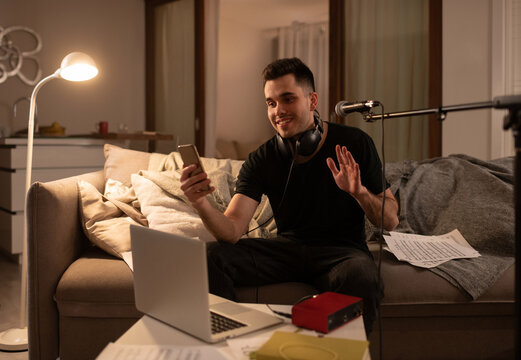 Friendly male musician making video call