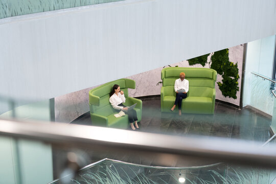 Multiracial businesswomen working in corridor