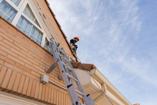 Professional worker performing building maintenance and repair