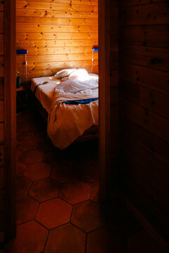 unmade bed in cabin