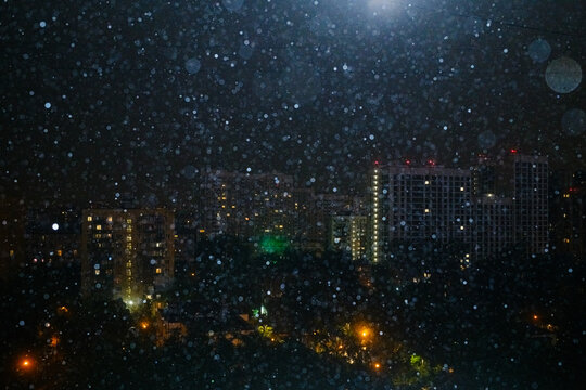 Rain Over Urban City District at Night During a Heavy Downpour