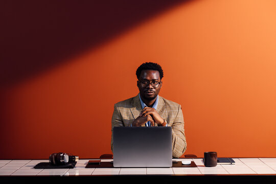 Businessman Working at Laptop in Office