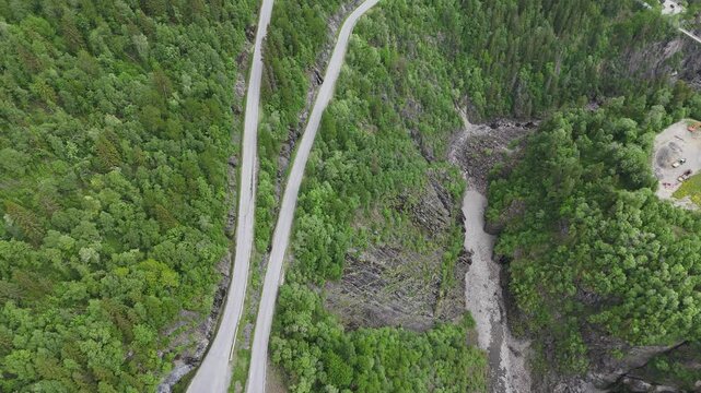 Aerial drone of Telemark road, trees, mountains and waterfalls, Norway