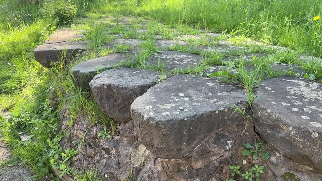Ancient Roman Cobblestone Street Built with Large Basalt Stones in Rome Italy