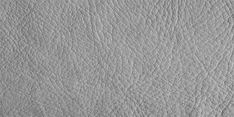 Fototapeta premium A close-up, seamless texture of soft grey leather with a natural, wrinkled grain, showcasing its subtle variations and supple quality.