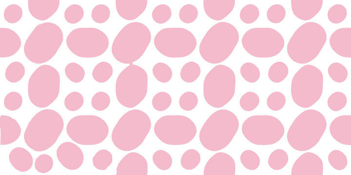 Seamless pink polka dot pattern with irregular rounded shapes on transparent background for textile and wallpaper design