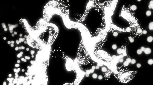 Abstract white particles on black background.