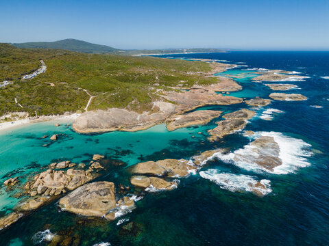 Aerial view of Greens Pool, featuring turquoise waters, large granite boulders, and white sandy beaches along the coastline in Denmark, Western Australia, Australia.