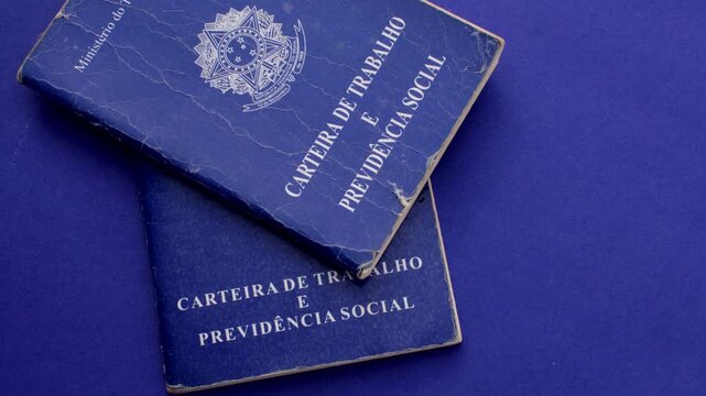 Brazilian work permit on blue surface: professional emblem in stark contrast with the blue background, representing the journey and value of work in Brazil.
