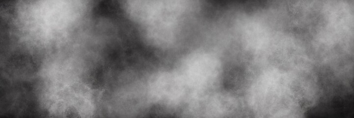 Fototapeta premium Panoramic monochrome smoky fog texture. Wide panoramic background of swirling grey and black smoke or mist