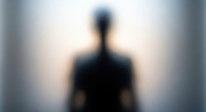 Silhouette of a person in darkness.
