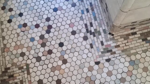 Antique hexagonal ceramic floor tiles in a colorful mosaic motion video