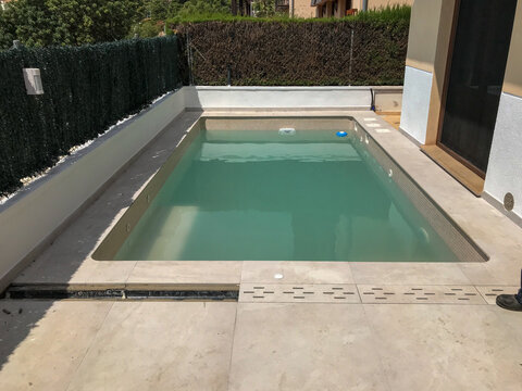 Residential swimming pool with fresh water and modern tiling