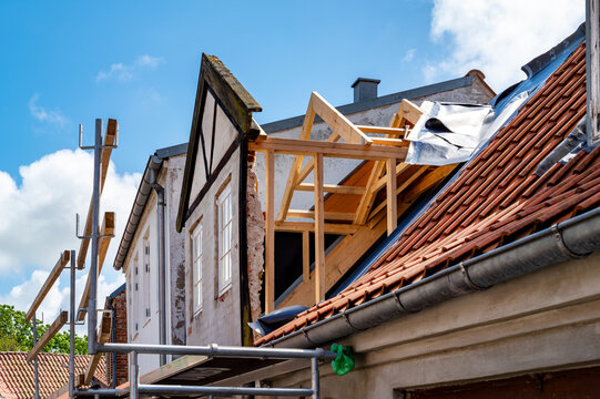 Restoration of a listed gable house with traditional timber construction.