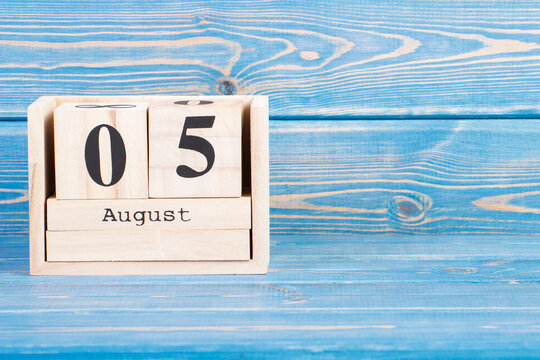 August 5th. Date of 5 August on wooden cube calendar