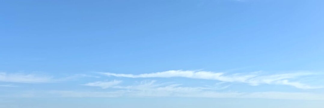 Cloudscape, Timelapse of beautiful blue sky with scattered wispy clouds on horizon, for wide background	