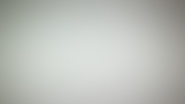 Minimalist soft grey gradient background with smooth lighting and subtle vignette effect for professional graphic design projects, clean empty space for text, modern neutral studio wallpaper