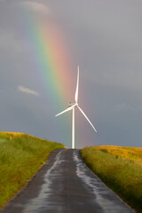 Naklejka premium rainbow and wind turbine in the north of france