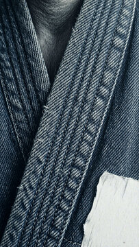 karate jeans close up of blue denim fabric with textured weave.