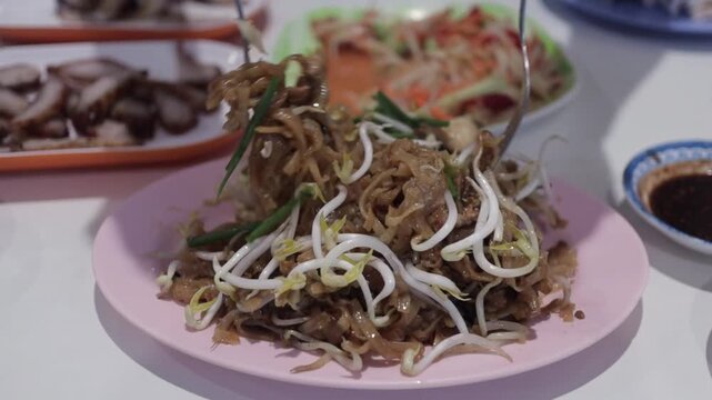 Hands Mix Thai Style Stir Fried Pad Thai. Fresh Cooked, Hot Pad Mee Korat Noodles In Isaan Street Food Restaurant